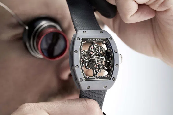 Richard Mille RM 55-01 manual-winding watch with a Grey Quartz TPT case, skeletonised movement and sporty tonneau-shaped design.