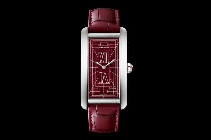 Cartier Tank Américaine in platinum with a rich burgundy Cadran Rouge dial, blued sword-shaped hands, ruby-set crown, and matching burgundy alligator leather strap.