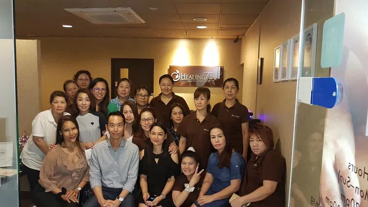 Joshua Lung (front row, in a light blue shirt) with some of his Healing Touch employees. Image credit: Joshua Lung