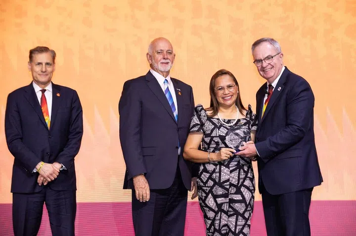 Evangeline Buella Mandia is presented with the Rotary International People of Action 2024 award. (Image: Rotary International)