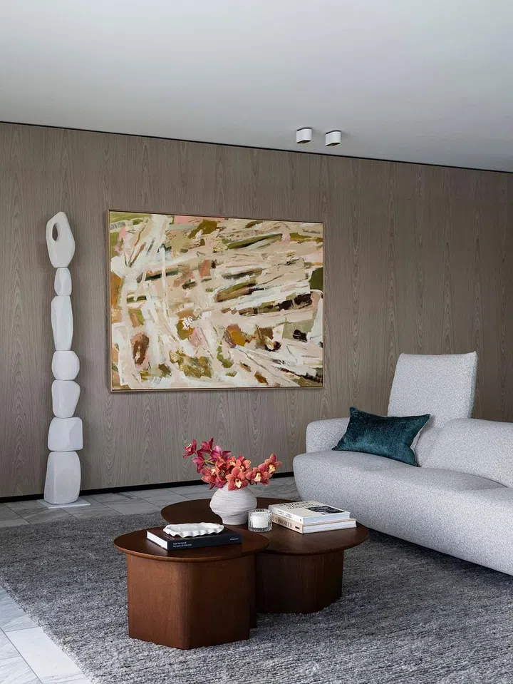 The Fleur Sofa, along with the Issho Coffee Table and Issho Side Table , help anchor the living room with their organic shapes. (Photo: King Living)