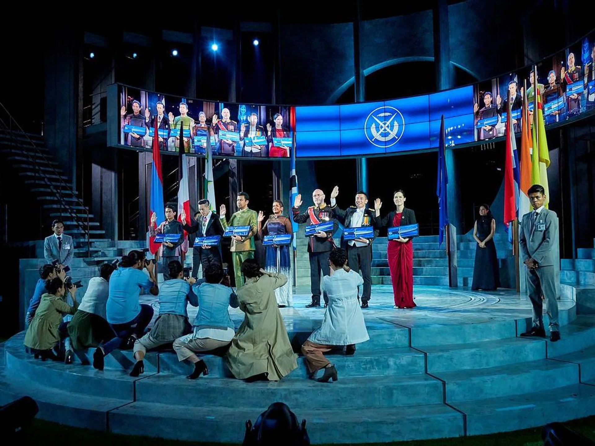 Press scrum around leaders of R.O.M.E, a global alliance consisting of seven nations that is an update of Rome's Senate.