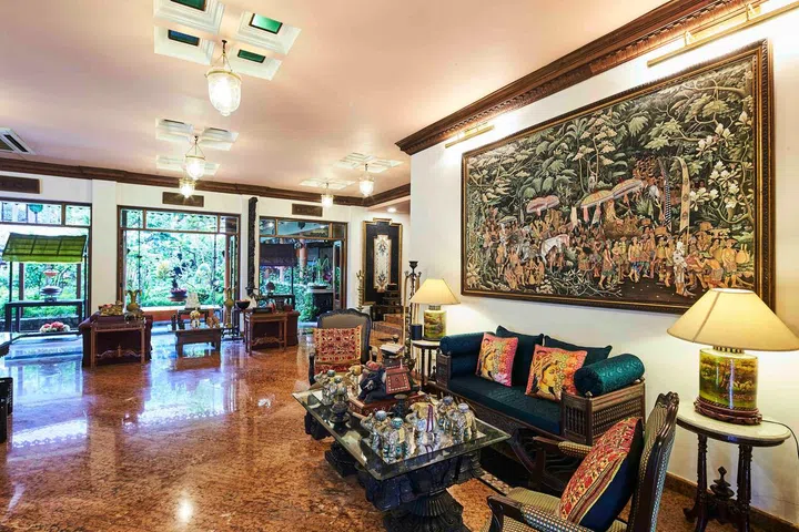 The interior of 35 Binjai Park with multiple artwork on the walls.