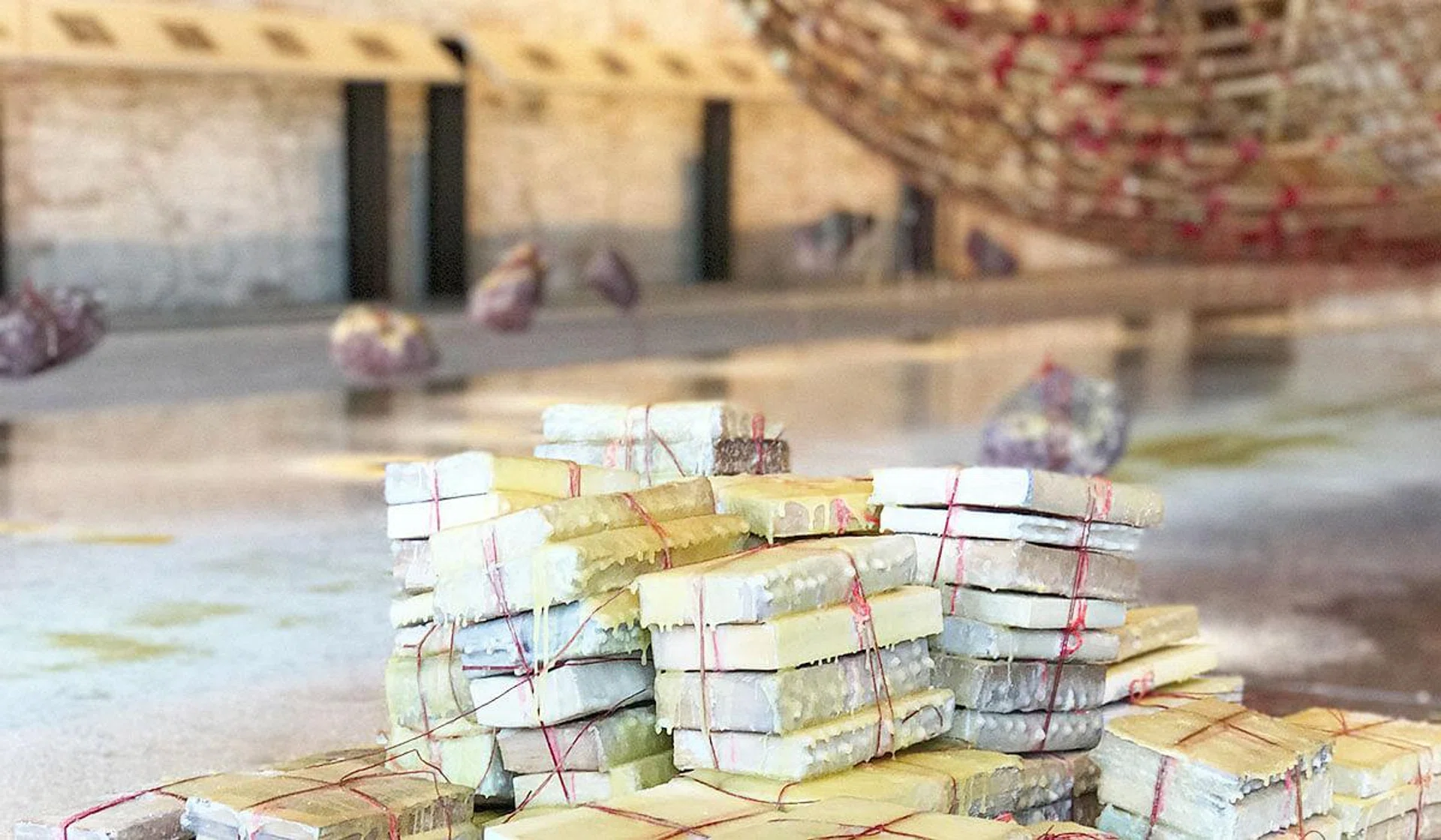 Piles of books, as many as 100, accompany artist Zai Kuning's magnificent 17-metre Phinisi ship. Each book is dipped in wax, never to be opened again, a metaphor for our lost histories.