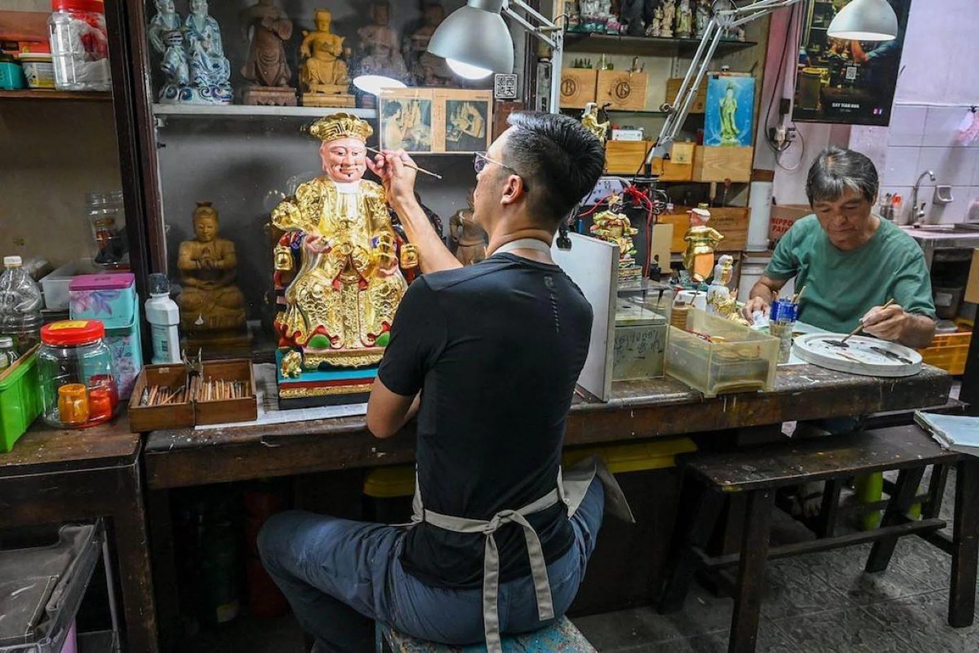 Facing competition from mass-produced items and lacking heirs to take up the trade, the traditional craft is in danger of dying out. (Photo: Roslan Rahman/AFP)