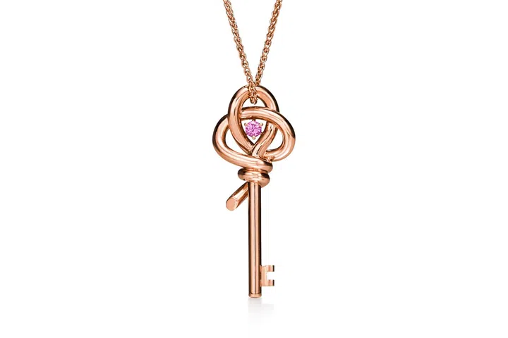 The Tiffany Knot Mini Key is now updated with a pink sapphire anchoring a rose gold pendant creation