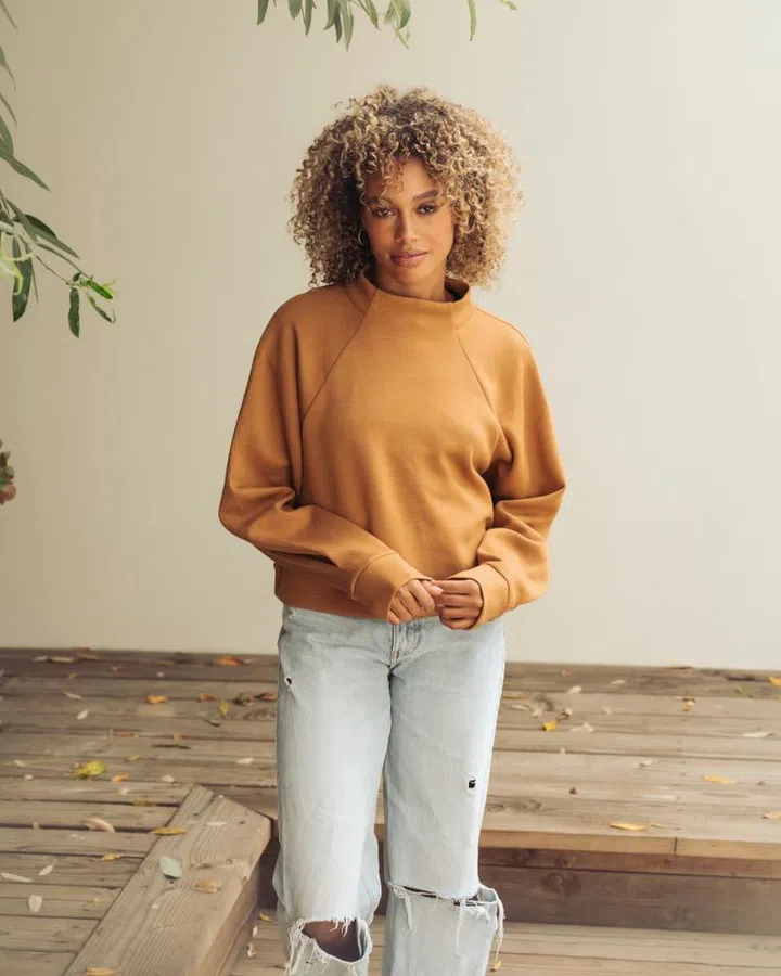 Model in Alala’s Phoebe Mock Knit, a piece recently seen worn by actress Emily Blunt. (Photo: Alala)