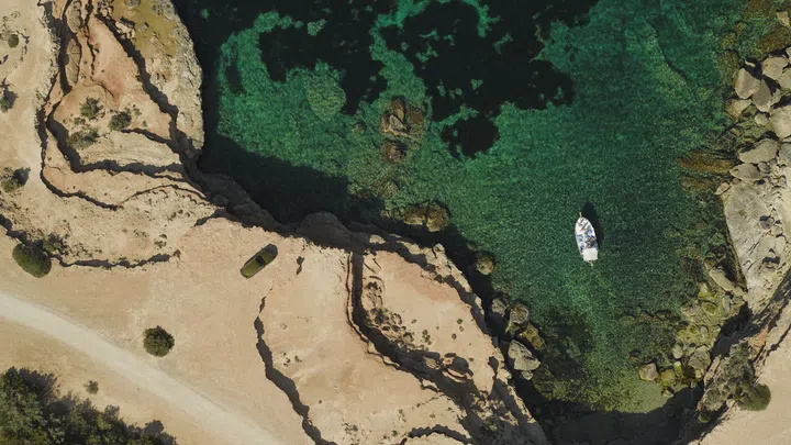 Under the Mediterranean sun: The rugged coastline of Ibiza provided the epic backdrop upon which we test-drove the Cullinan Series II over the summer. (Photo: Rolls-Royce)