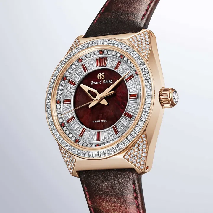 Grand Seiko Spring Drive 8-Day Jewelry Watch “Red Lion” SBGD228 in rose gold with a wine-red mother-of-pearl dial set with diamonds and Mozambique garnets, paired with a textured red Kyoto Leather strap.