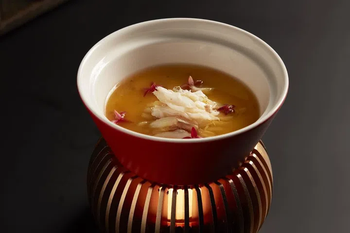 Steamed Homemade Tofu with Freshly Peeled Crab Meat and Yuzu Pepper, where silky tofu meets sweet crab meat brightened by zesty yuzu pepper, will surely impress. (Photo: Taste Paradise)