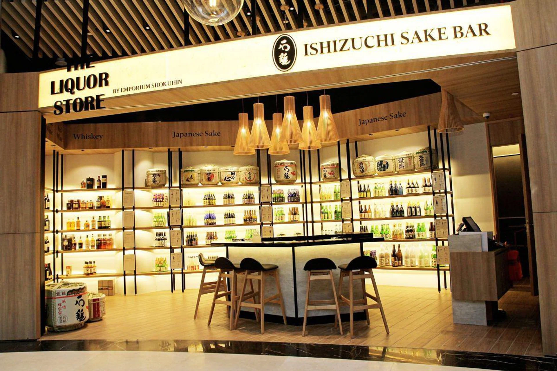 <h3>01: Exclusive sakes</h3>
Partnering with sake brewer Ishizuchi Shuzo, Emporium Shokuhin launched a sake bar featuring more than 60 blends. Along with that, it’s attached liquor store offers exclusive sale of the award-winning Ishizuchi Gentei Daiginjo Tobindori ($480). Other premium sakes from Juyondai, Dassai, Kokuryu and Tatenokawa are also available.