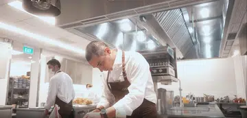 Chef Julien Royer cooking at Claudine Restaurant