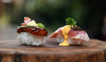 Inka nigiri duo with tuna tataki and soy-pisco braised pork jowl