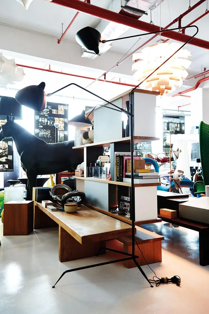 A lover of modern architecture, Tay bought this functional but visually arresting shelf as it reminded him of the late pioneering architect, Le Corbusier. “Charlotte was from the same era as Corbusier. They were all modern masters.” Having acquired the three-pronged lamp for an estimated $14,000, he feels a strong connection to it. “Construction for this piece is simple, but it is really about form following function.”