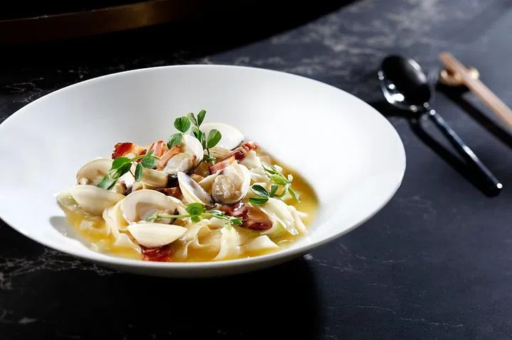 A Madame Fan signature: Handcut Taiwan noodles with wind-dried pork and lala clams 