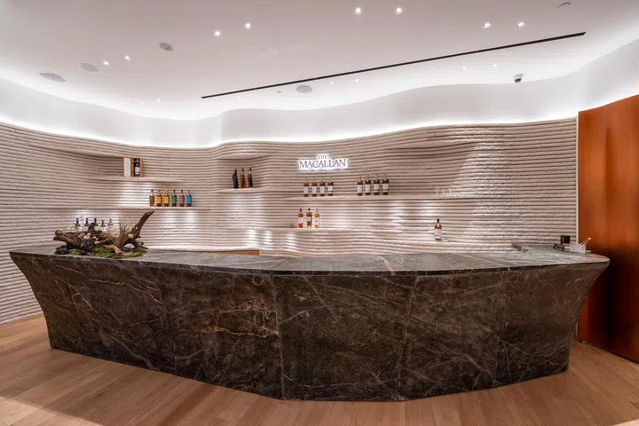 Enjoy your favourite drams at the bar, where the wavy, textured wall behind pays homage to dried, sun-torched stone found in Jerez, Spain – home of The Macallan’s famed sherry casks. (Photo: The Macallan)