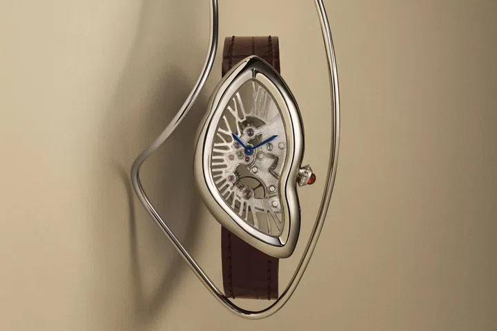 Cartier Prive Crash Skeleton watch in platinum with distorted case shape and openworked movement featuring Roman numeral bridges