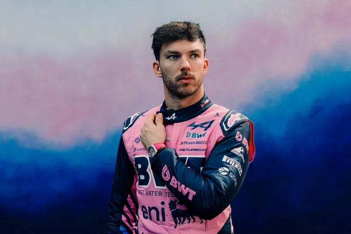 Pierre Gasly wearing the H. Moser & Cie. Streamliner Alpine Drivers Pink Edition with its skeletonised dial and pink rubber strap.
