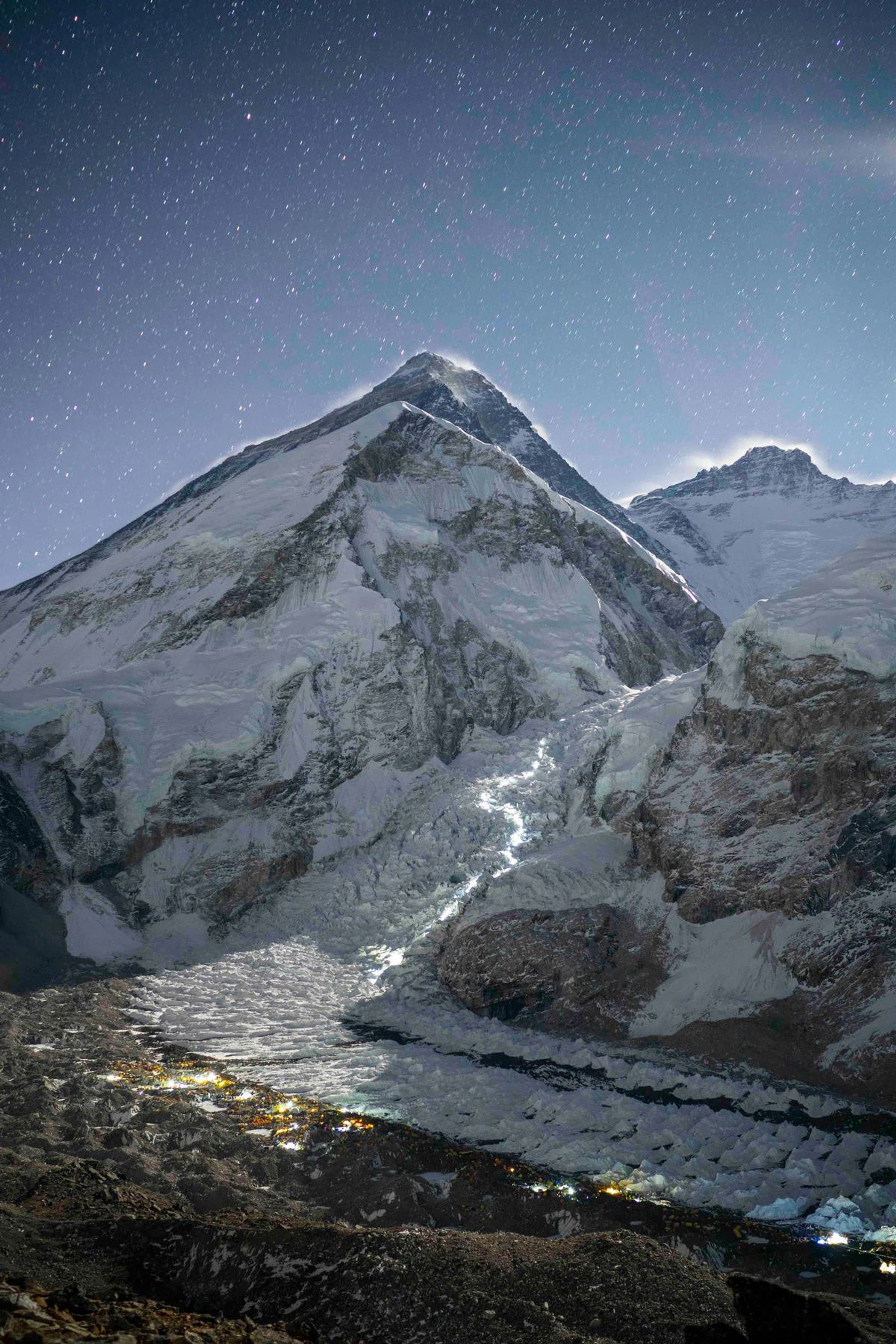 Head lamps illuminate the path that climbers take as they move up the Khumbu Icefall above Everest Base Camp.