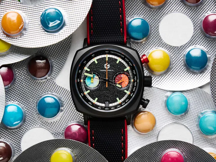 Singapore watch brands: The Geylang Watch Co Apex Hybrid Chronograph with a matte black PVD-coated stainless steel case, an asphalt-textured black dial with red and blue chronograph counters, and a black FKM rubber strap.