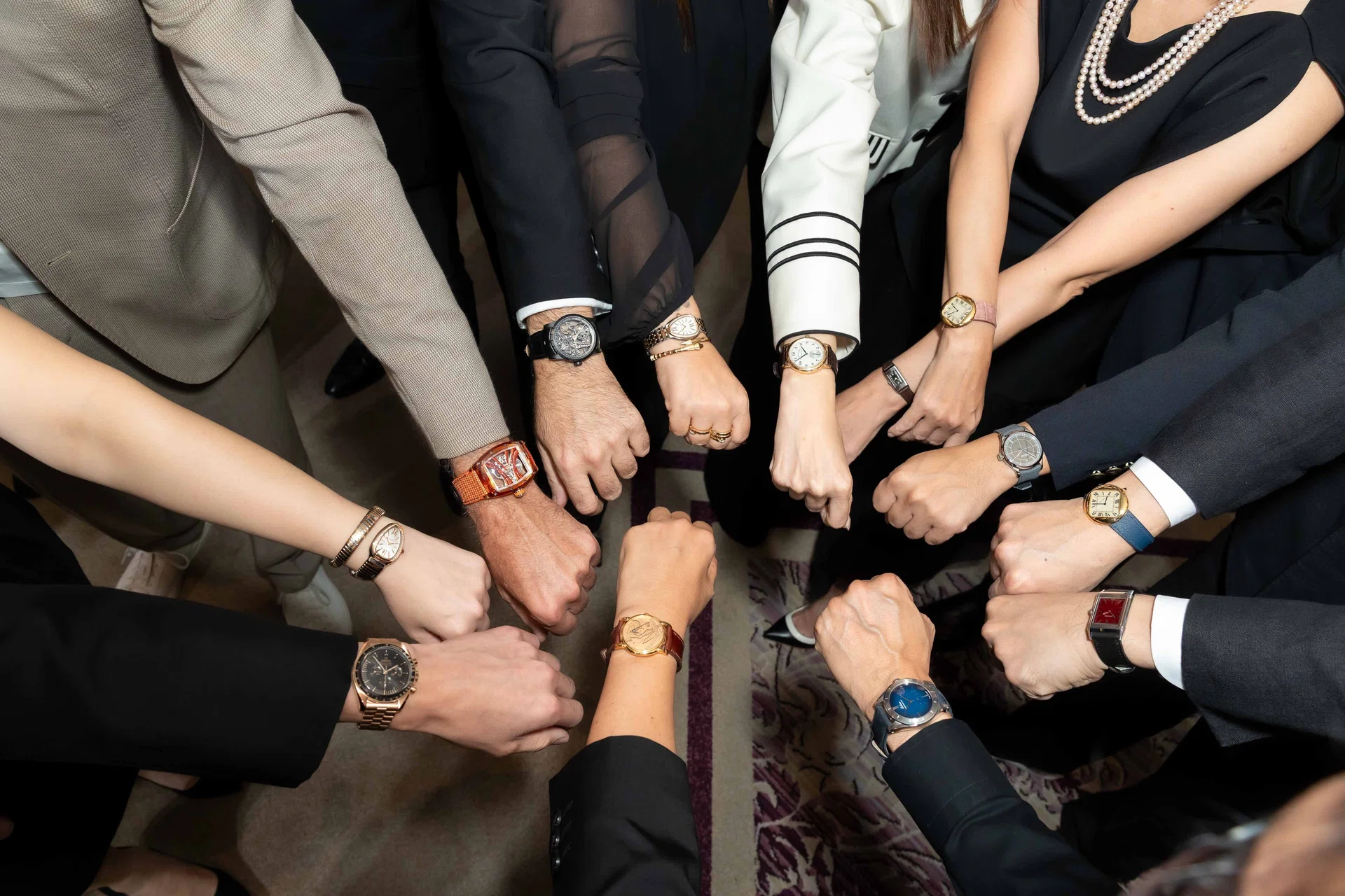 A group of watch collectors supporting Siam Paragon Bangkok Watch Week 2026 holding up their wrists to show their watches.
