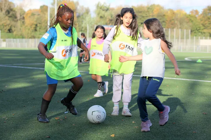 Participants in the Futbalo Girls programme taking part in a football training session, an initiative that uses sport to empower girls and young women through confidence-building, teamwork and leadership development.
