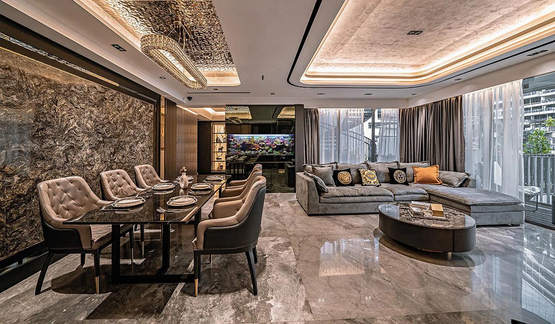 Large-format Italian marble tiles are complemented with beautifully detailed accents for an upscale feel in this penthouse apartment at The Interlace.