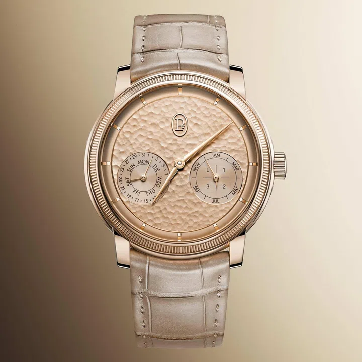 Parmigiani Fleurier Toric Quantième Perpétuel in rose gold, featuring a hand-hammered Bright Peony dial, minimalist perpetual calendar display with twin subdials, and the collection’s signature knurled bezel.