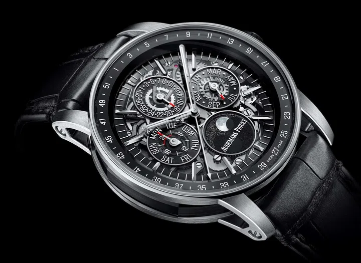 Audemars Piguet Code 11.59 Selfwinding Perpetual Calendar Openworked in white gold and black ceramic, featuring an openworked dial with smoked sapphire subdials, pink gold accents, moon-phase display and black alligator leather strap.