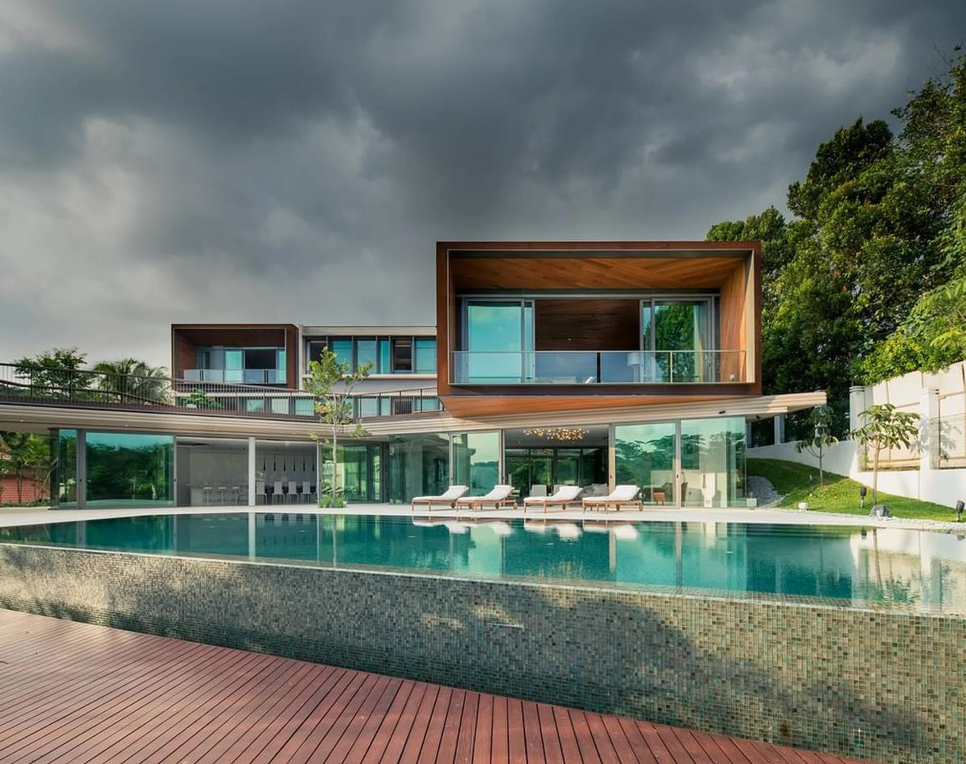 Perforated cream limestone and aged teak dominate. 