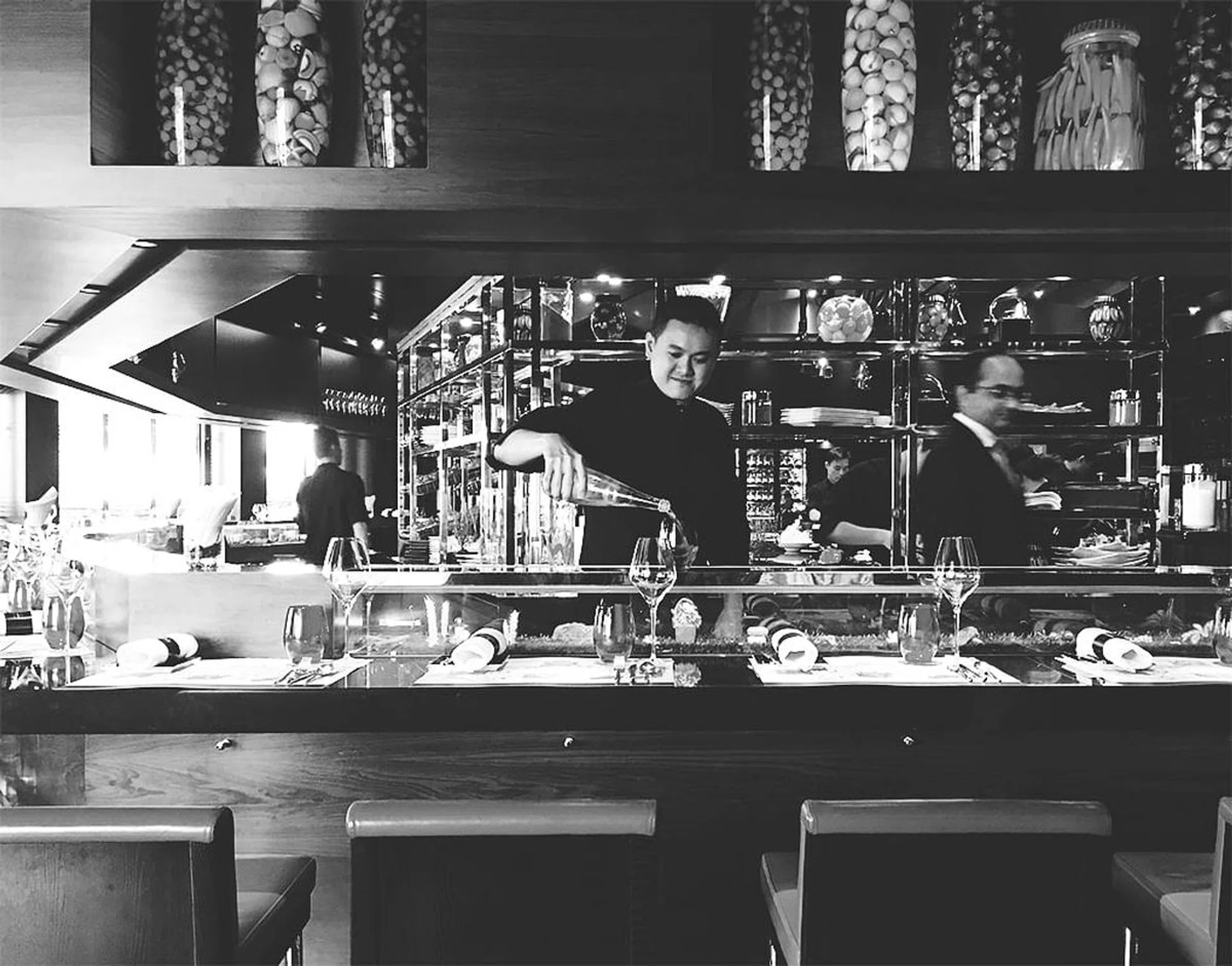 A seat at the counter offers front-row access to the ongoings in the kitchen. 