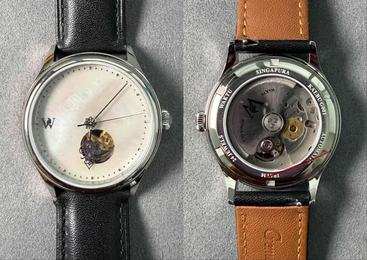 Singapore watch brands: Front view of the Waktu Horology Kalbu M.O.P. Puteh with its white mother-of-pearl dial and open-heart display, alongside the exhibition caseback of the Kalbu M.O.P. Gelap revealing the Miyota 90S5 automatic movement.