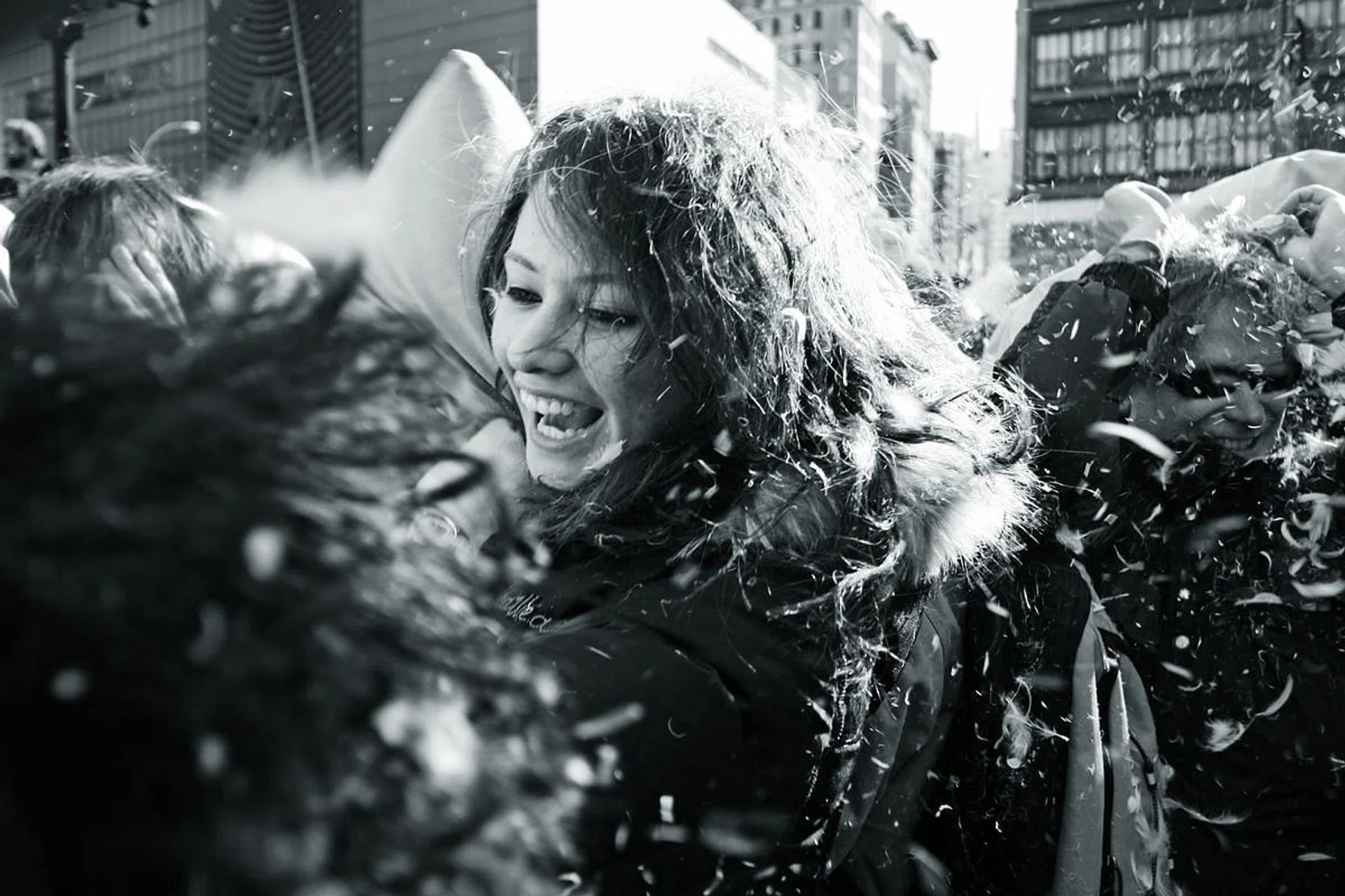 <b>PILLOW FIGHT, NEW YORK </b>
<br><br>
People just showed up at Union Square at noon with pillows under their jackets. I am not a pillow fight kind of person, but photography gave me an excuse to be among them.
