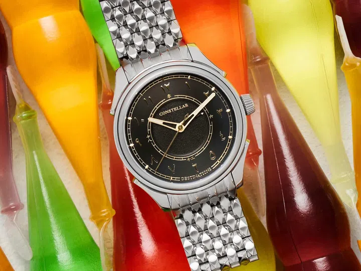 Singapore watch brands: The Constellar Timepieces Destinations GMT with a black dial featuring Eastern Arabian numerals, Chinese characters for the GMT display, a 39mm stainless steel case, and the integrated Starlink bracelet.