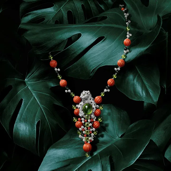 Cartier Panthere Confiante High Jewellery white gold necklace with peridots, ribbed coral beads, diamonds, and onyx. (Photo: Cartier)