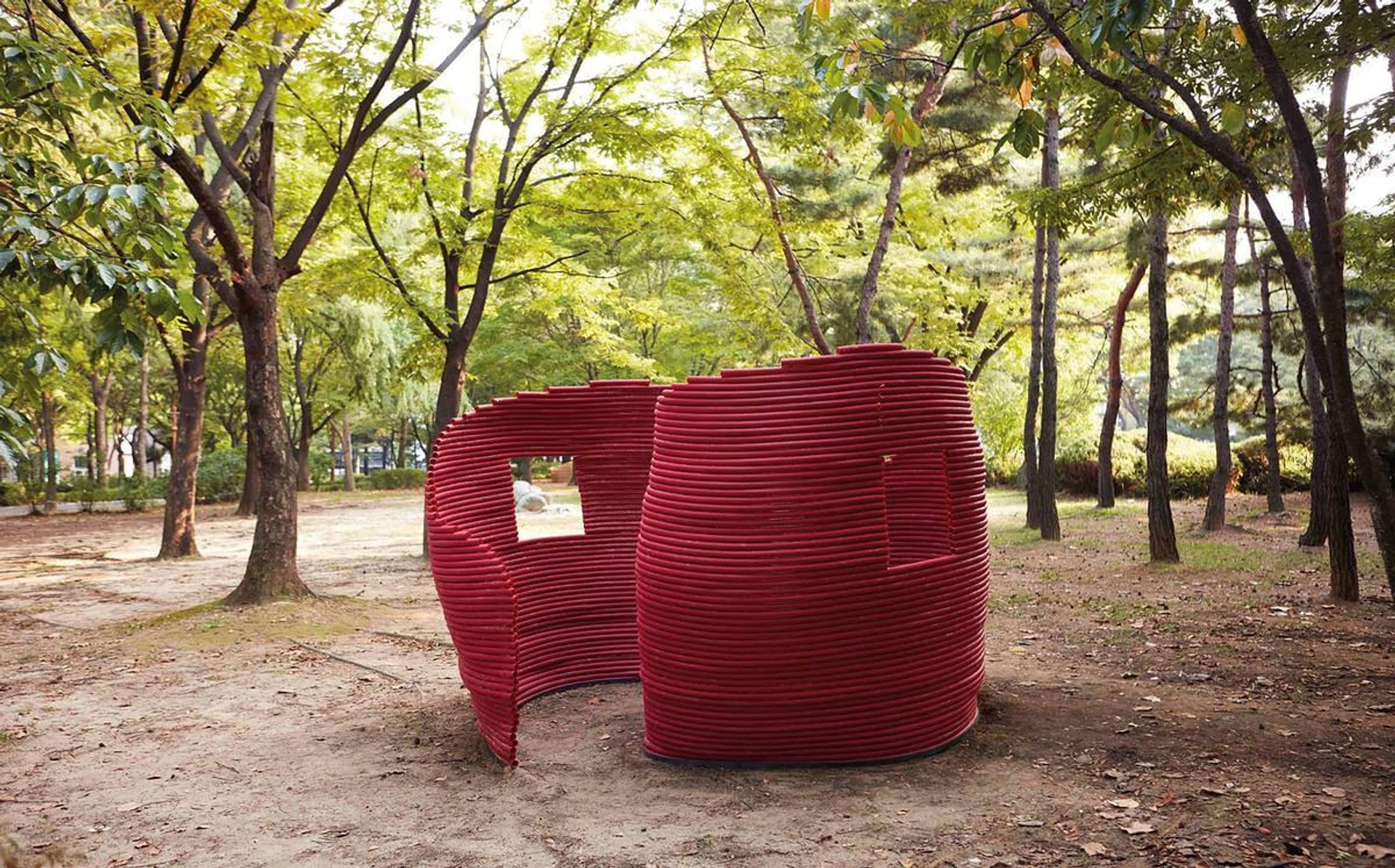<b>LOVERS WALL BY O. YOUNG WOOK </b> <br>The red wall separates visitors yet connects them at the same time through their voices carried via the tubes used to construct the installation.