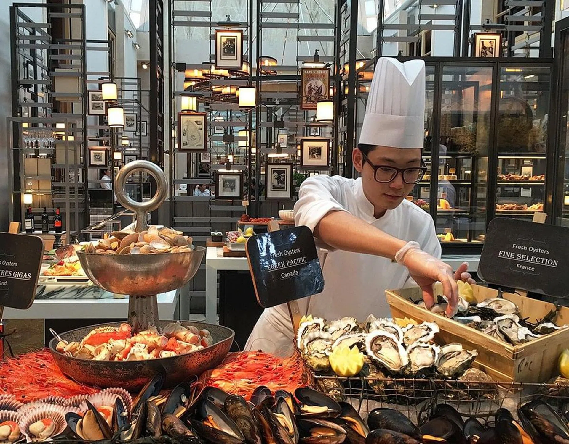 Colony's culinary team shucks a variety of fresh oysters flown in from France and other parts of the world.