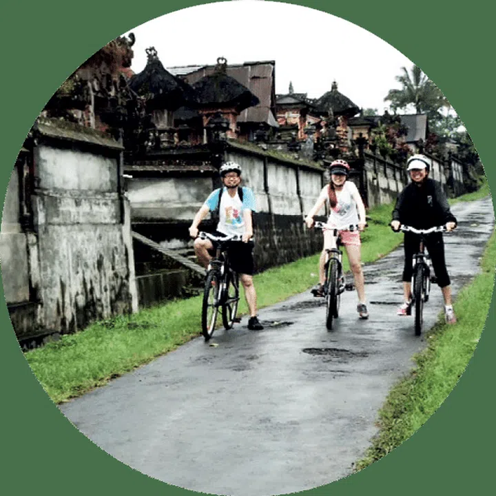 Chong and family cycling in Ubud, Bali.