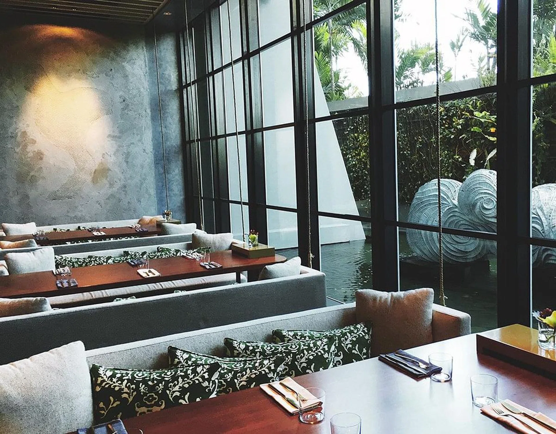Booths by the window are bathed in natural light and offer a different perspective of the restaurant. 