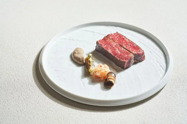 Wagyu striploin with pickled shiitake, shiitake puree, kohlrabi salad