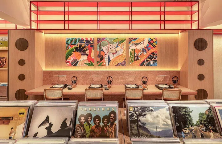 Swee Lee’s vinyl library/cafe features pillars dressed in wood veneers, made to look like floor-standing speaker boxes. (Photo: Caldecott Music Group)