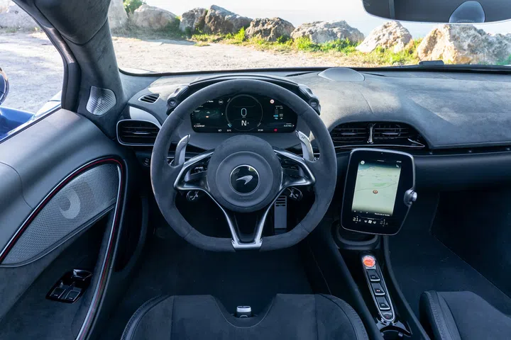 The pared-down, driver-focused cockpit of the Artura Spider, which, for the first time in McLaren history, features a Start/Stop button in “papaya” orange instead of red. (Photo: McLaren)