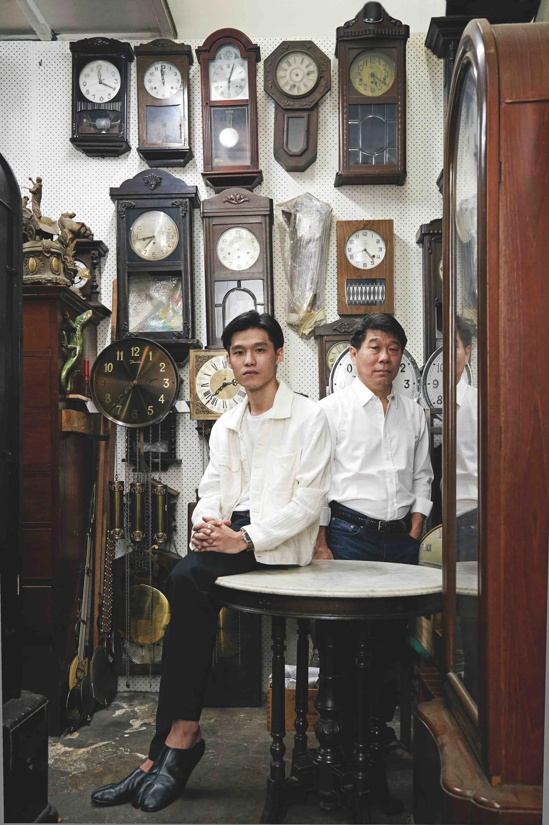 Shawn Lim is the third generation business owner of Cheong Ann Watch Maker. He is pictured beside his father David.