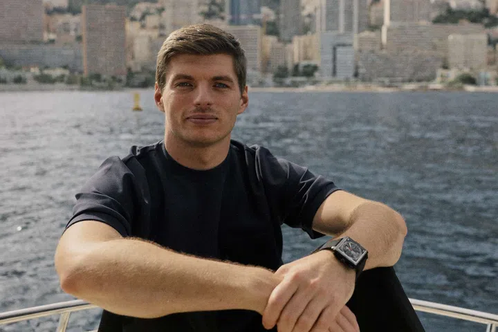 Max Verstappen wearing the TAG Heuer Monaco Speed 12 with its open-worked dial and 12 rotating piston-shaped hour indicators.