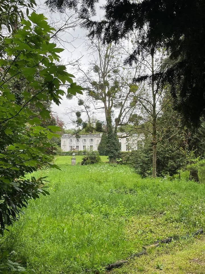 Chateau de la Petite Malmaison peeking through the trees. Photo: Grace Ma 