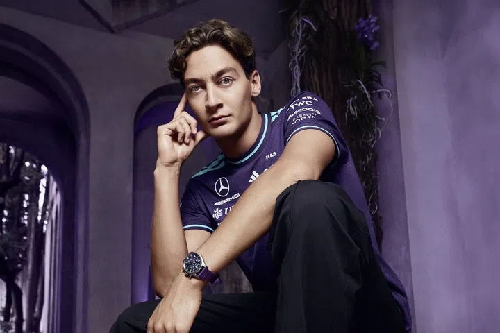 George Russell wearing the purple IWC Pilot’s Watch Chronograph 41 Mercedes-AMG PETRONAS Formula One Team.