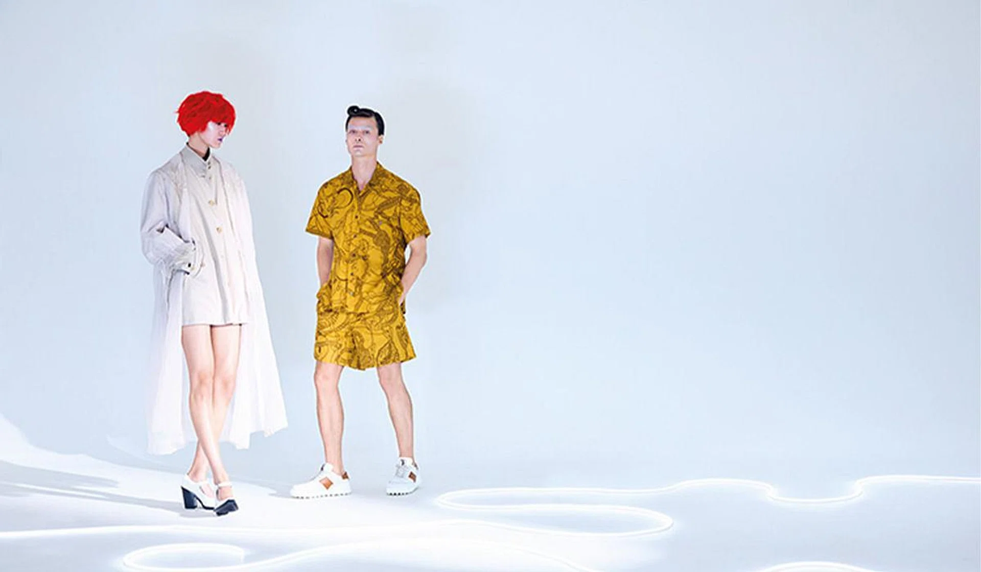 (On her) Tulle coat, polyester jacket, and leather heels, from Prada. (On him) Cotton shirt and shorts, and suede sneakers, from Tod's.