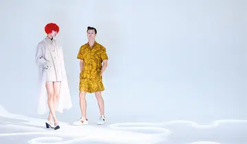 (On her) Tulle coat, polyester jacket, and leather heels, from Prada. (On him) Cotton shirt and shorts, and suede sneakers, from Tod's.