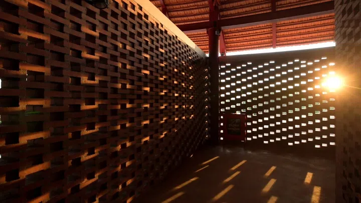 Sunlight peeks through the perforated walls at The Gong. (Photo: Smiling Gecko Cambodia)