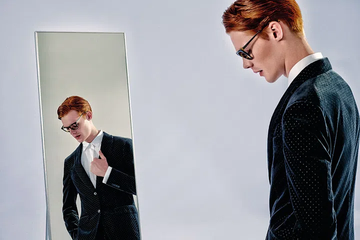 Dots add plenty of flair to a debonair essemble. Black velvet suit and white cotton shirt, from Ermenegildo Zegna. Tortoiseshell glasses, from Prada.